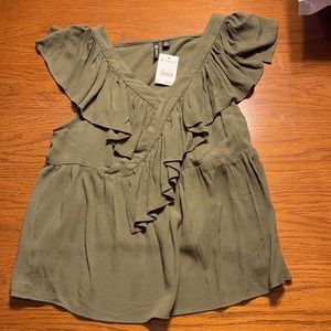 Green ruffled blouse